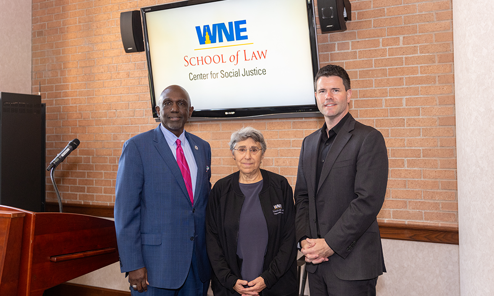 Dr. Johnson stands with partners from MassMutual and MGM at the ǿ޴ý School of Law